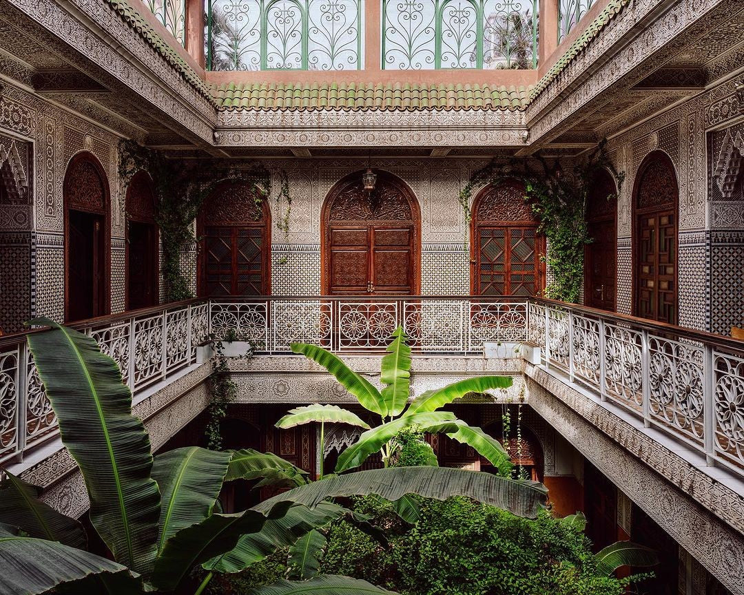 Moroccan architectural interior with plants and decorative tiles